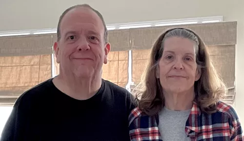 Brother and sister standing next to each other celebrating weight loss.