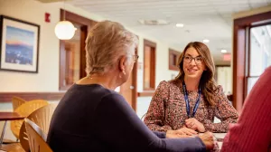 Social worker, Danica Grillo, meeting with family at High Point House about family resources.