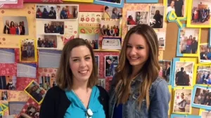 Claudia Freeman, RN and Jacqui Webb, Boston Marathon bombing survivor, pose in front of a bulletin board filled with photos at Tufts Medical Center.