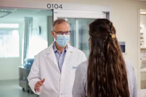 nurse outside a bay of the Intensive Care Unit (ICU).