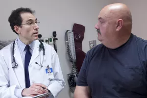 Patient working with endocrinologist, Richard Siegel, MD in the Weight and Wellness Center.