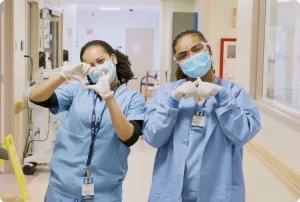 Drs making heart figure with hands