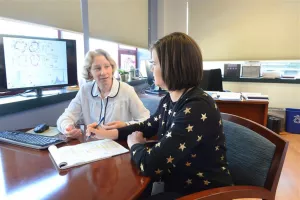 MCRI Training and Education discussion at desk