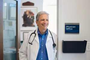 John Ragucci, MD standing in office doorway at Lowell General Hospital's Family Care office.