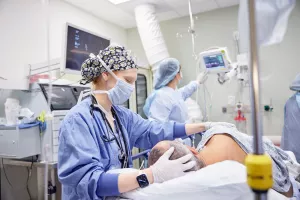 Nurse comforting patient before a colon and rectal surgery.