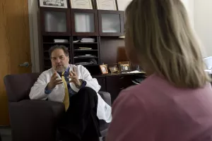 Paul Summergrad, MD, Psychiatrist-in-Chief at Tufts Medical Center, consults with a patient.