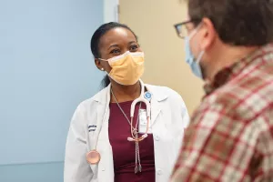 Nurse practitioner talking with patient