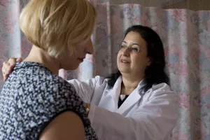 Tufts Medical Center's Physiatrist Rina M. Bloch, MD treats examines patient in a clinic appointment.