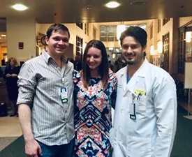 Jacqui flanked by surgical residents Thomas Crosslin, MD (left) and Michael Blea, MD who cared for her during her stay Jacqui flanked by surgical residents Thomas Crosslin, MD (left) and Michael Blea, MD who cared for her during her stay