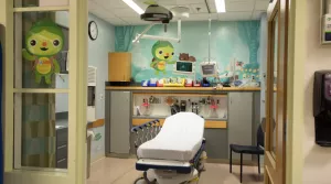 Pediatric emergency department room with illustrations of Toughlings on the walls and window Pediatric emergency department room with illustrations of Toughlings on the walls and window
