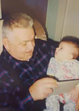 Albert reading to his grandson